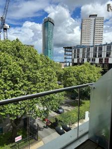 a balcony of a building with trees and buildings at Luna Stays Ltd apartment 37 in Birmingham