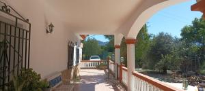 an arched entry way to a house with a driveway at Villa Oasis in Los Gallardos