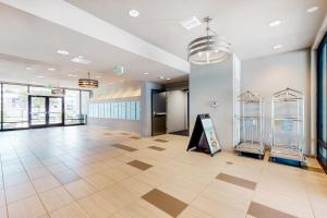 a large lobby with a sign in the middle of a building at 2 Mi to UF Campus! Dog-Friendly Condo w/ Pool in West Hills