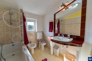 Vannituba majutusasutuses Apartman Iva