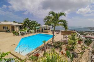 an image of a swimming pool at a house at Executive 1 Bedroom Poolside Apt Kilele suite in Christiansted