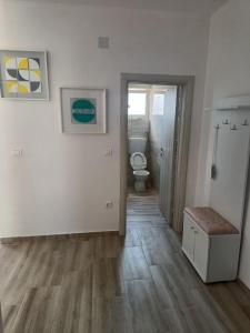 an empty bathroom with a toilet in a room at Darija in Dobra Voda +23 photos