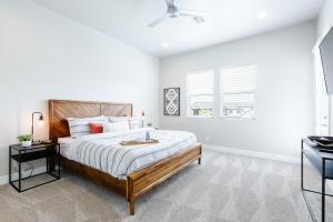 a white bedroom with a large bed and a window at Ocotillo Springs 27 Southern Utah Adventure Paddle Boards, Kayaks, Home Gym, Community Pool and Splash Pad in Santa Clara +95 photos