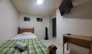 Postel nebo postele na pokoji v ubytování Hotel San Vicente + 37 fotografií
