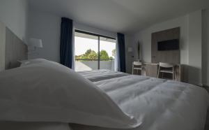 Cama o camas de una habitación en Hotel La Palma de Llanes