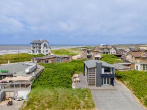 a house on a hill next to the ocean at Beachhouse I in Bergen aan Zee
