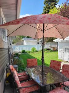 a table with an umbrella on a patio at My Home in Calgary