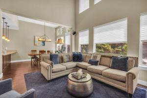 a living room with a couch and a table at Charming 3BR-Near Skiing & Hiking in Kamas +15 photos