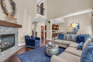a living room with a couch and a fireplace at Charming 3BR-Near Skiing & Hiking in Kamas