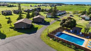 an aerial view of a resort property with a swimming pool at Cavendish Country Inn & Cottages in Cavendish