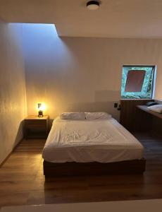 Postel nebo postele na pokoji v ubytování Casa Tonalli