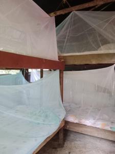 Cama o camas de una habitación en Eco Hospedaje Ata Ladrilleros