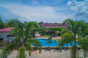 an overhead view of a resort with palm trees and a pool at Panglao Village Court Apartment Stay Inn in Panglao