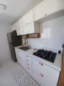 Køkken eller tekøkken på Apartamento em Campina Grande