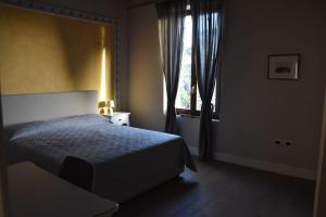 Postel nebo postele na pokoji v ubytování Ultroneo, Locanda di collina