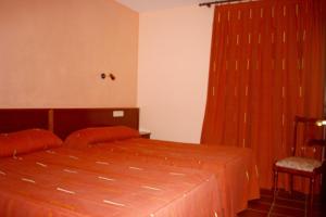 Postel nebo postele na pokoji v ubytování Apart-Hotel Selva Nevada