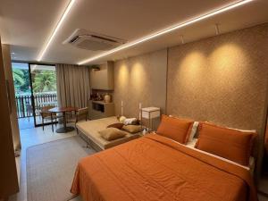 Khu vực ghế ngồi tại Studio Premium - Beira Mar - Pé na Areia - Praia dos Carneiros