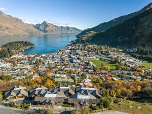 an aerial view of a village on the shore of a lake at Karamata by MajorDomo in Queenstown