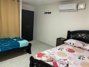 Postel nebo postele na pokoji v ubytování Piantini Houses