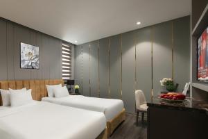 Voodi või voodid majutusasutuse Ping Hotel toas