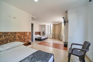 Postel nebo postele na pokoji v ubytování Hotel Express Medellin FARUM