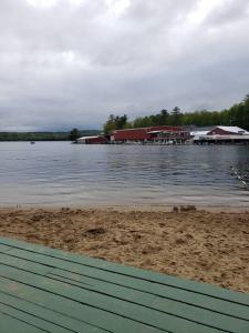 a view of a body of water with a dock at Lakefront Cottage on Beautiful Lake Winnipesaukee in Laconia