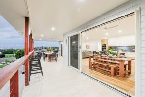 an internal view of a house with a patio and dining area at Aquatic Abode in Agnes Water