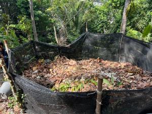 a black trash can full of leaves at Cookies Salad Resort in Salad Beach