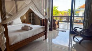 Postel nebo postele na pokoji v ubytování Wardana Ubud Villa