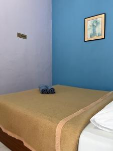 Postel nebo postele na pokoji v ubytování Rayyan's Roomstay
