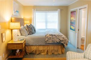 a bedroom with a bed and a window at Moon Baby in Santa Rosa Beach