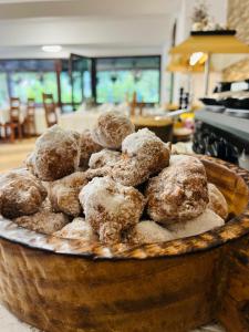 a basket full of donuts sitting on a table at Pensiunea Zimbrul in Poiana Brasov