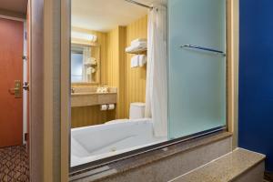 a bathroom with a bath tub and a sink at Holiday Inn Express New York City Chelsea, an IHG Hotel in New York