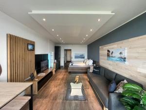 a living room with a couch and a television at Themenpartment Penthouse in Gelsenkirchen