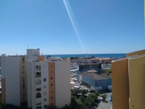 a view of a city from a building at Carnon-plages - Agréable Studio cabine in Mauguio +1 photo