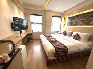 Rúm í herbergi á ViaVia Boutique Hotel - Kathmandu