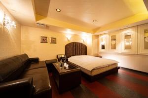 Hotel MINT Osaka Airport客房内的一张或多张床位