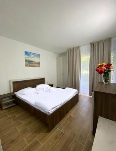 Postel nebo postele na pokoji v ubytování Hotel Rodica