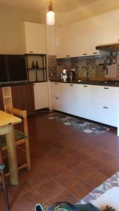 Kuchyň nebo kuchyňský kout v ubytování La Rondinella