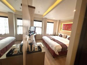Rúm í herbergi á ViaVia Boutique Hotel - Kathmandu