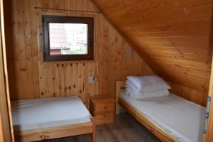 Postel nebo postele na pokoji v ubytování Promyk