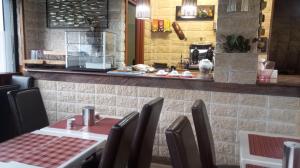 a dining room with a table and chairs in a restaurant at sleep well hotel total 2 stelle in Pisogne