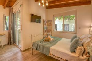 Postel nebo postele na pokoji v ubytování Vitis Vinifera Tranditional Studio Apartment