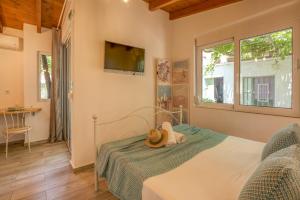 Postel nebo postele na pokoji v ubytování Vitis Vinifera Tranditional Studio Apartment