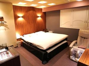 Letto o letti in una camera di ホテルロイヤルトン