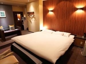 Letto o letti in una camera di ホテルロイヤルトン