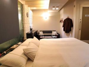 Letto o letti in una camera di ホテルロイヤルトン