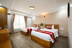 Postel nebo postele na pokoji v ubytování The River Park Hotel