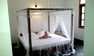 Letto o letti in una camera di Sunstyle Mirissa Guest House