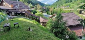 an overhead view of a house with a green yard at Casa Bella in Vadu Moţilor +66 photos